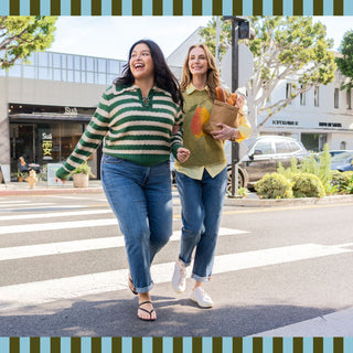 Shop Judy Blue new arrival jeans – two women in denim walking in the city